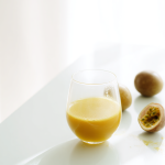 Alisoltani_a_clear_glass_of_rich_golden_Passion_fruit_juice_p_a43653d8-6dca-4b7f-88e5-6f1bbab14975_0